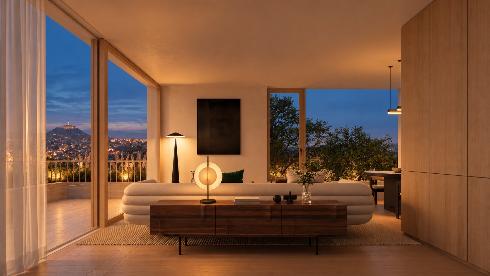 The Penthouse living room at night, with Budapest and the lit Citadella beyond the glass